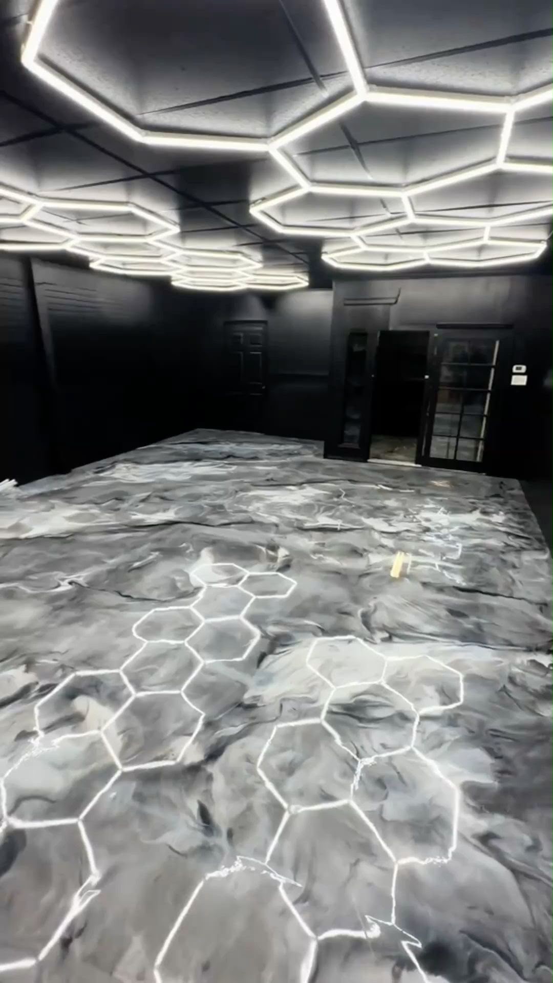 Titanium swirl metallic epoxy floor in a showroom, gloss
